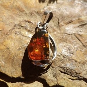 Authentic amber pendant set in silver